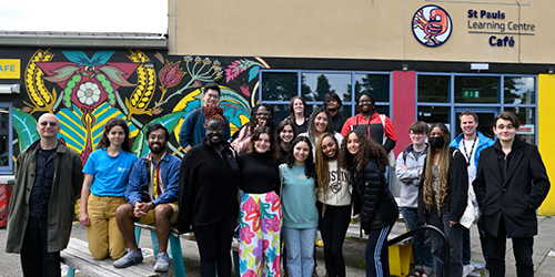 Group of summer school participants standing together outside St Pauls Learning Centre.